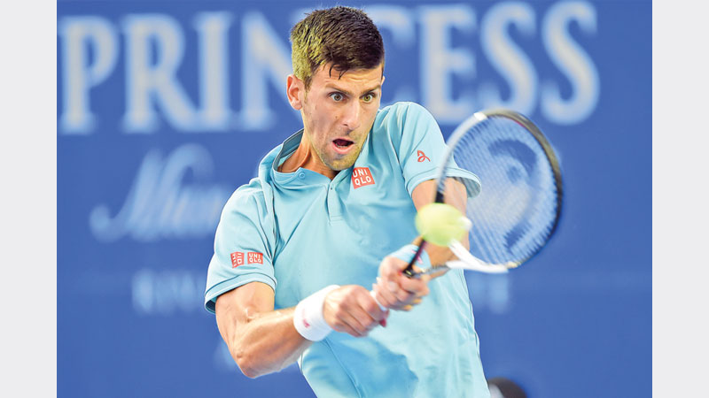 Djokovic, Nadal ease into second round