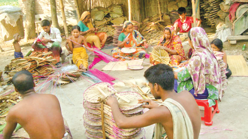 Over 30 families busy making hand-fans 