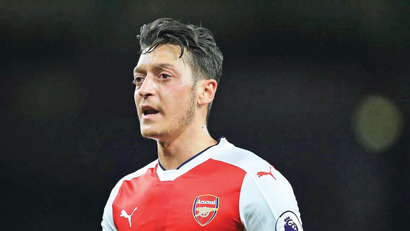 Ozil makes summer break 
away from football 