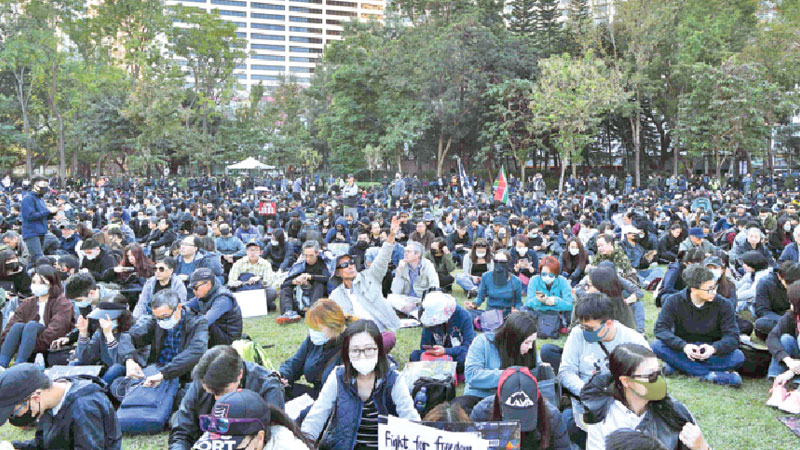 Hong Kong marks half year protest anniversary with huge rally