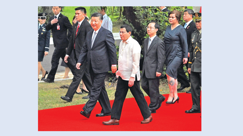 Xi visits Philippines to cosy up to US ally