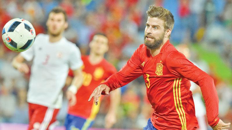 ‘Proud’ Pique to carry on for Spain 