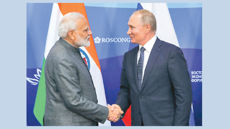 Putin, Modi vow to boost military, trade ties