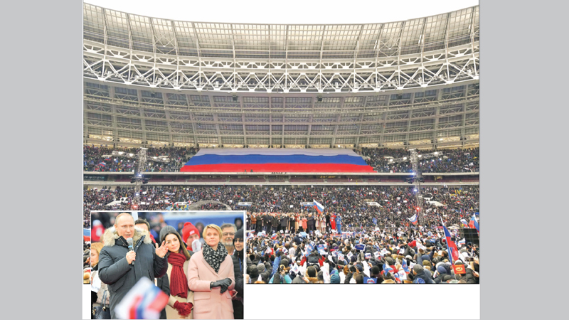 Putin promises 
‘victories’ at 
star-studded rally