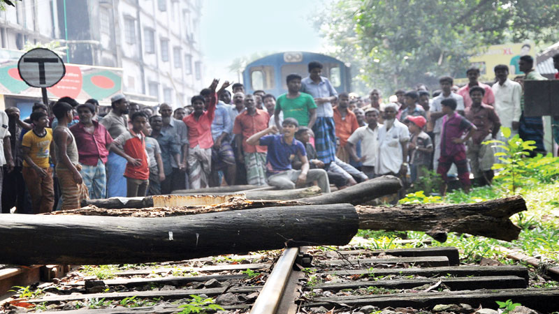 RMG, jute mill workers block roads for arrear wages