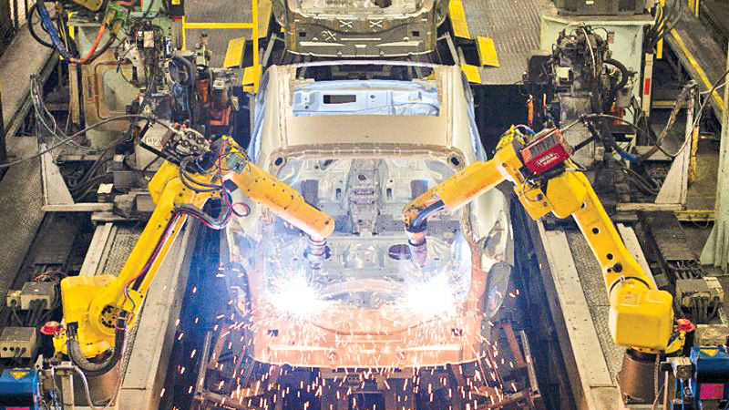 Robot arms replace factory hands
