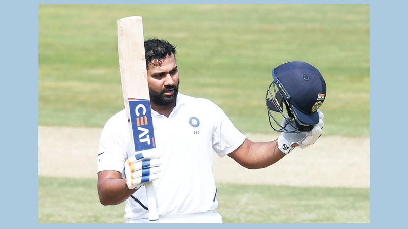 Rohit Sharma hits ton in
new role as Test opener