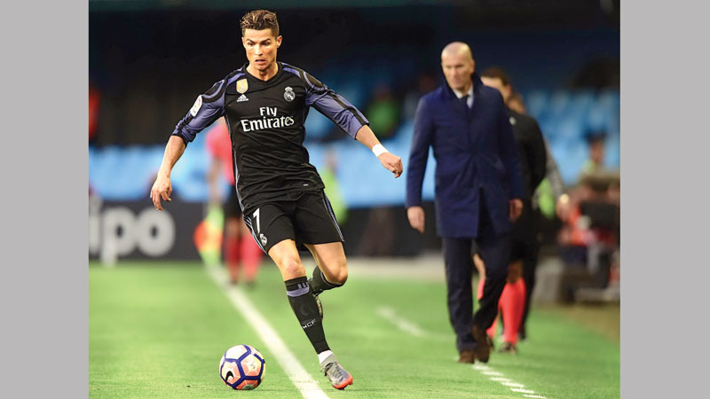 Ronaldo double puts Real within point of title