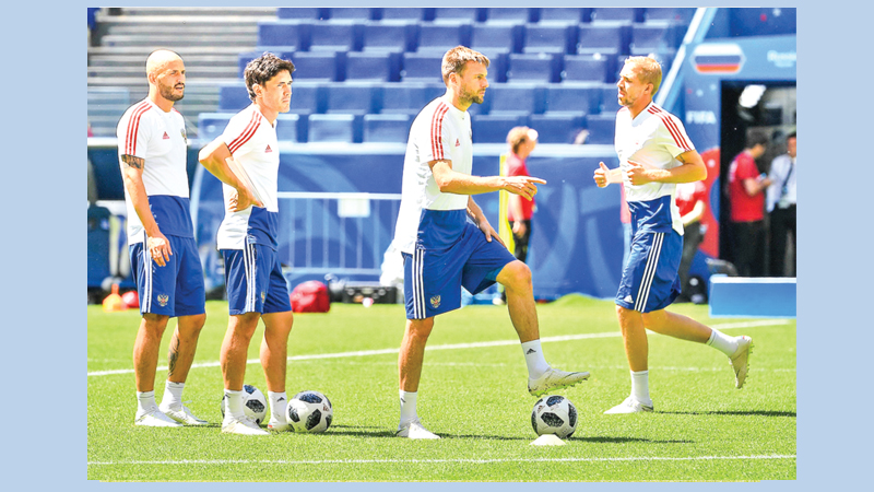 Russia battle Uruguay for group top spot today