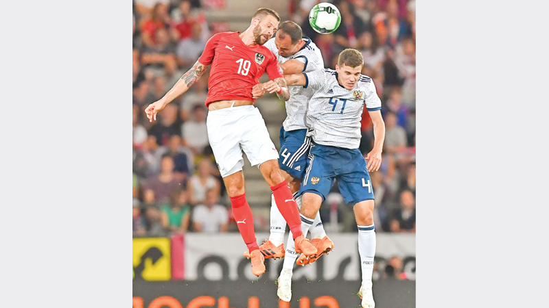 Russia gets good draw in weak Group A