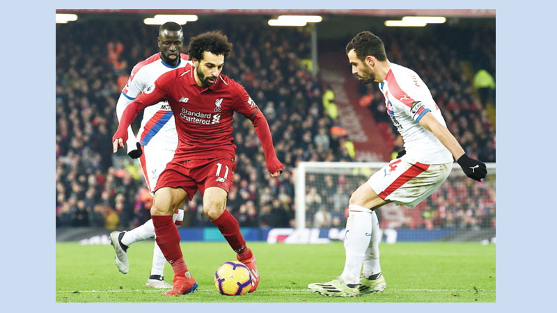 Salah double keeps Reds on top