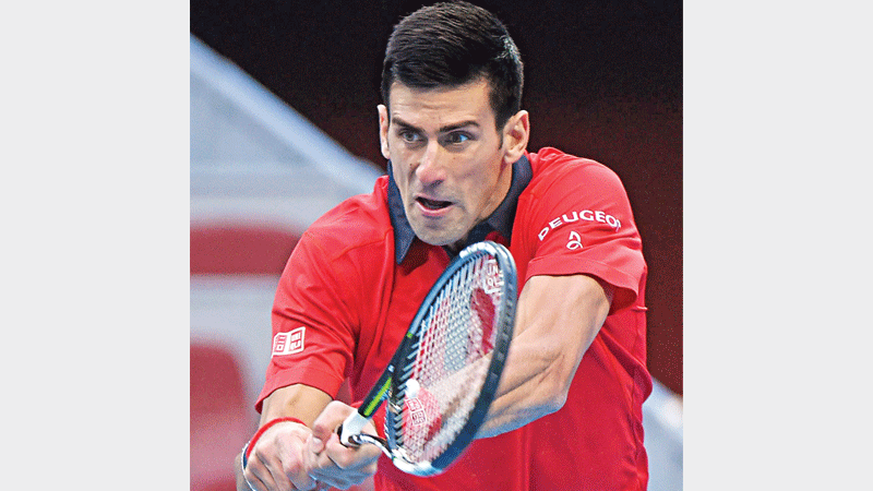 Djokovic reaches quarters in style