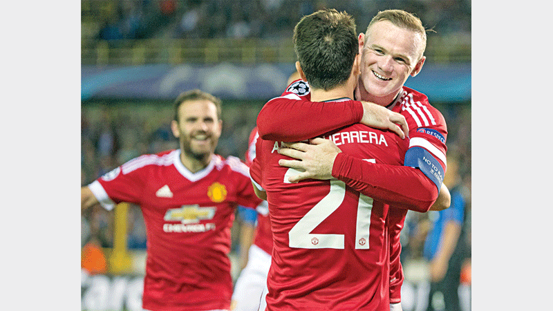 Manchester United ride on Rooney treble
