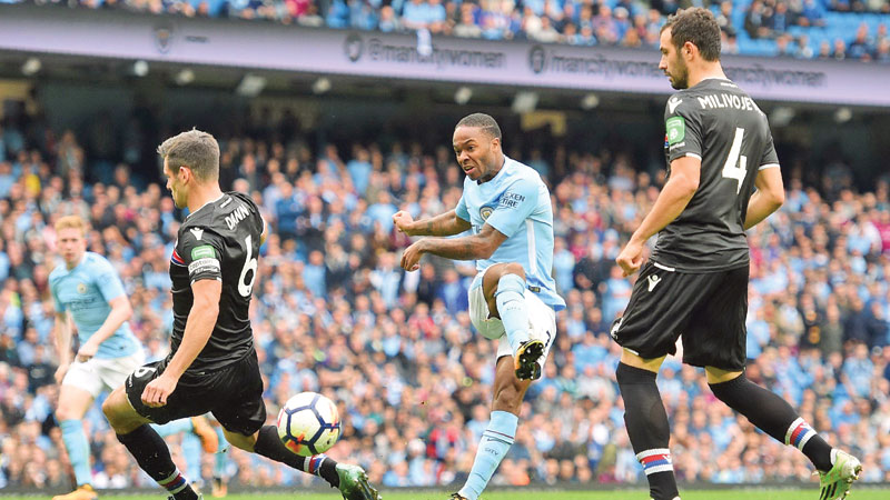 Lukaku, Sterling keep Manchester clubs on top