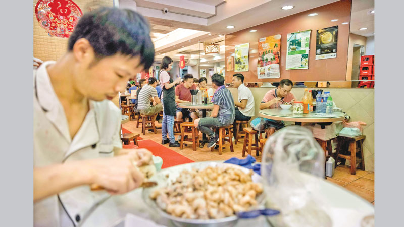 Street joints and empires in noodle-crazed Hong Kong