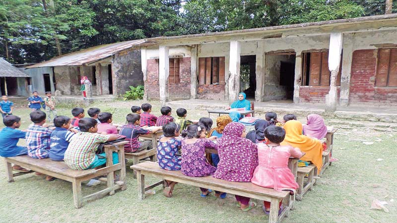 Students attend classes under open sky