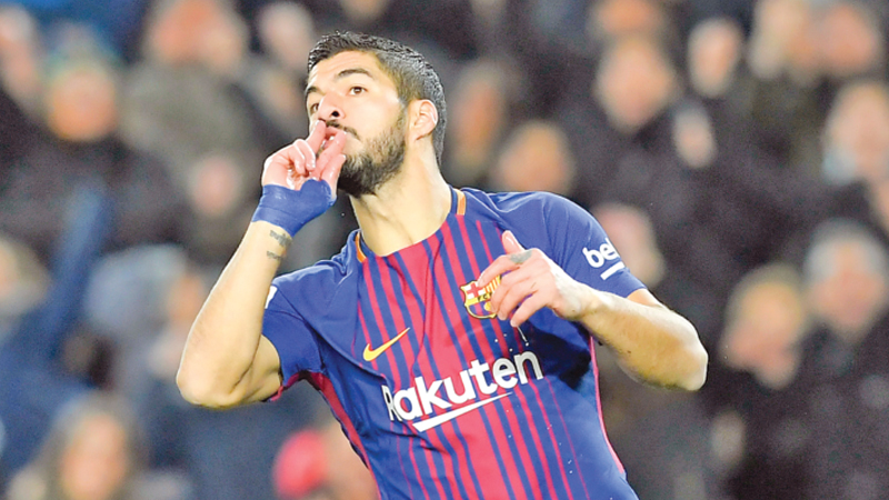 Suarez hat-trick extends Barca’s lead