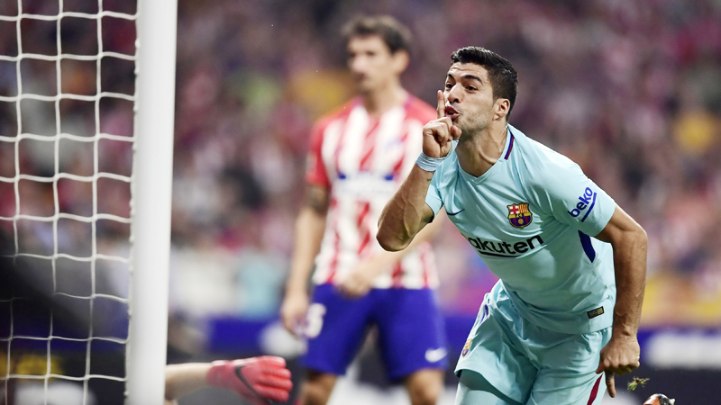 Suarez earns Barca point at Atletico