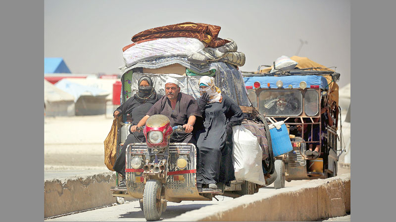 US-backed Syria force advances in Raqa, battles for base
