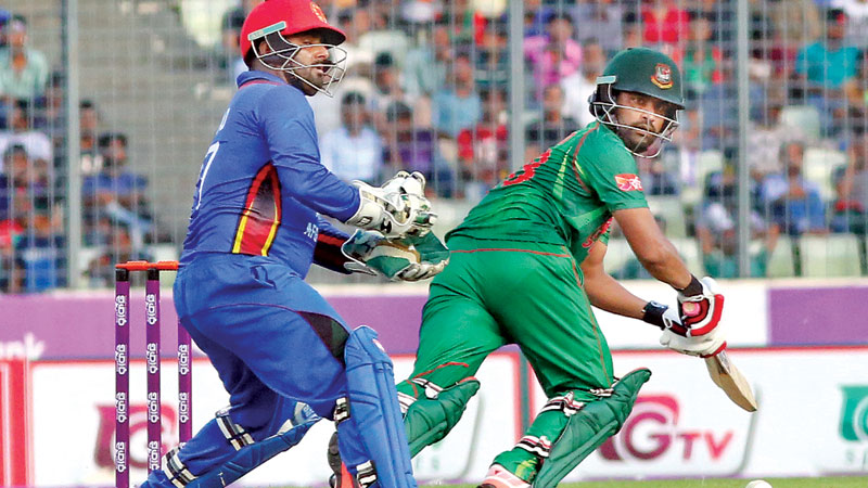 Tamim holds the fort with record 7th ton