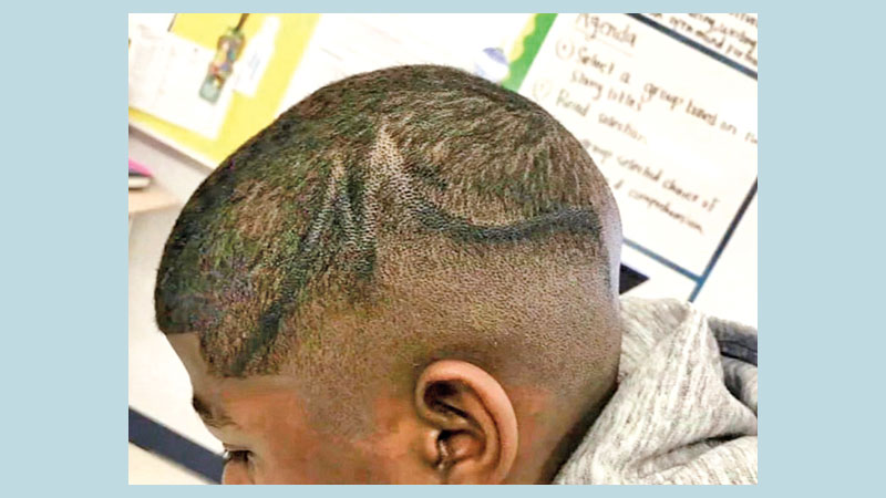 Texas school sued for coloring black pupil’s scalp with marker