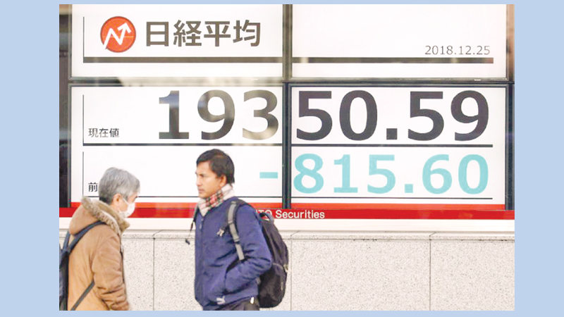 Tokyo stocks plunge in Christmas rout