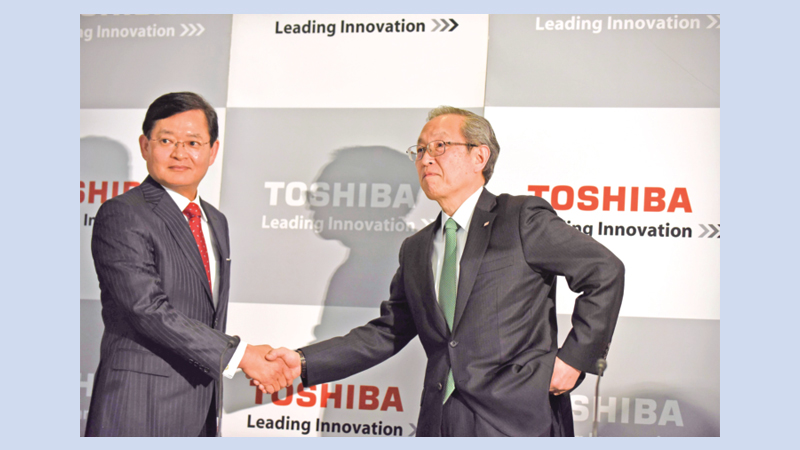 Toshiba tips return to black as it sells chip, nuclear units