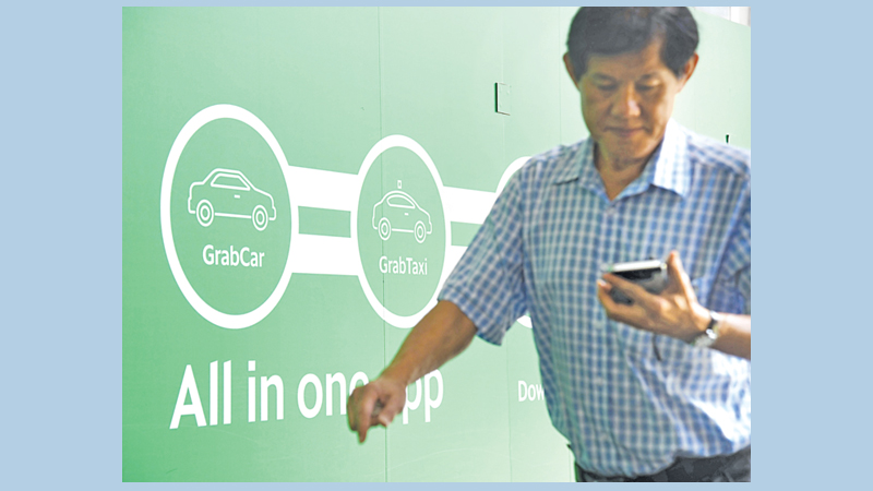 Toyota investing $1b in ride-share firm Grab