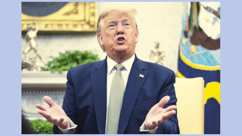 Trump signs bill to help telecoms replace Huawei equipment