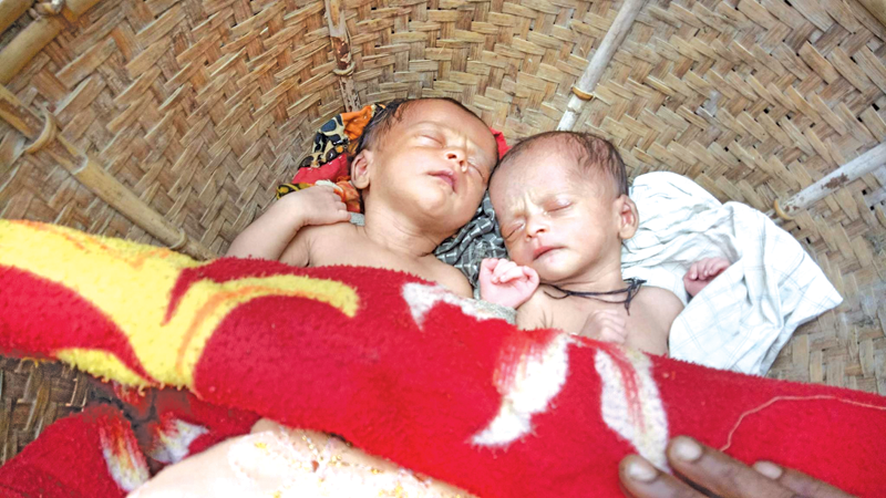 Twins born to fleeing Rohingya couple in jungle