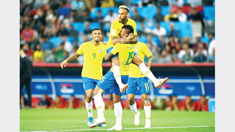 Unbeaten Brazil cruise into last 16