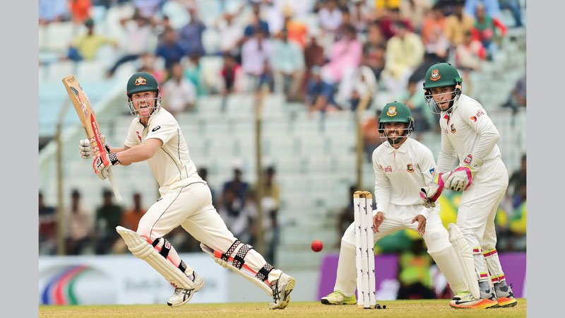 Warner, Handscomb  guide Aussies to strong position