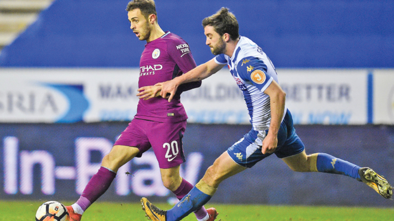 Wigan end Man City quadruple bid 