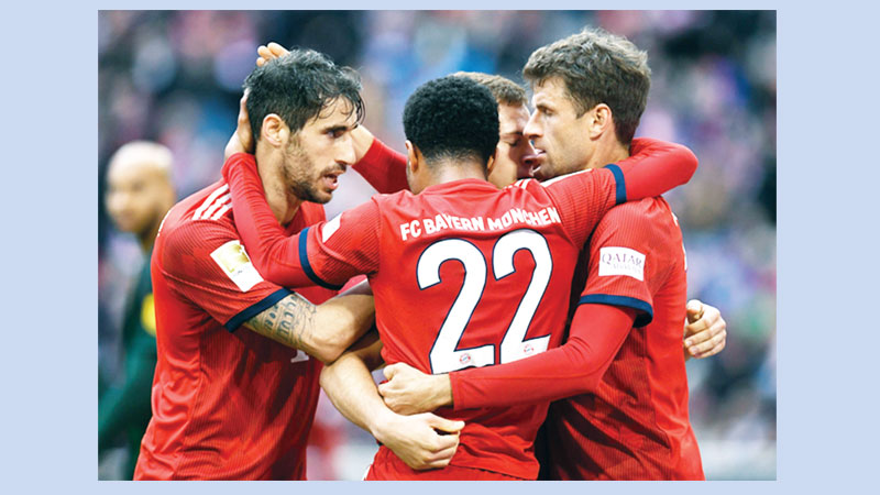 Bayern back on top with Wolfsburg goal spree