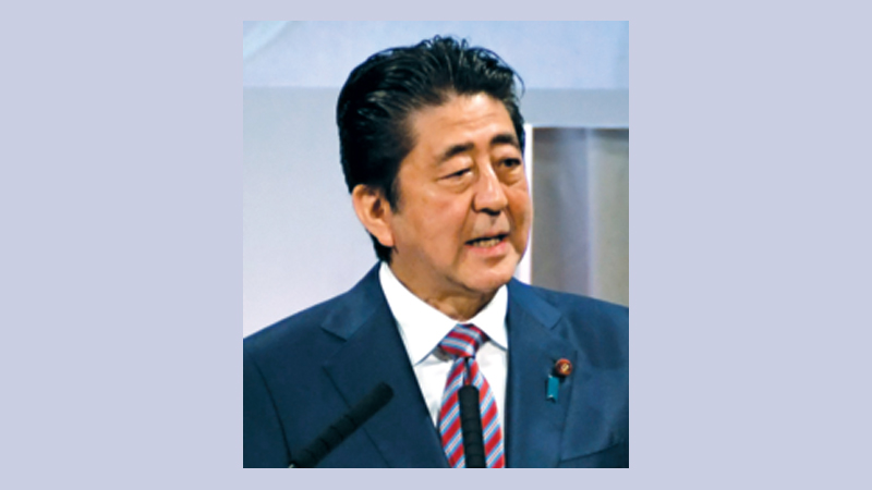 Abe pledges constitution change amid scandal