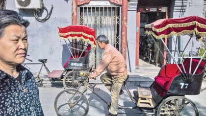 Beijing’s rickshaws teeter between tradition, survival