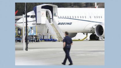 Boeing to take $4.9b charge over grounded jet