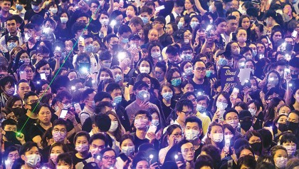 China rotates troops in HK as police ban new rally