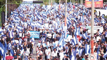 French unions vow no surrender in month-long strike