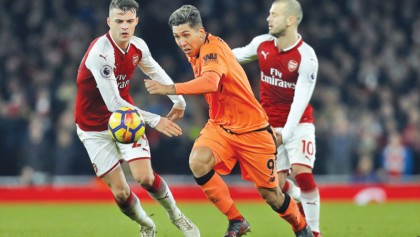 Liverpool survive Arsenal fightback