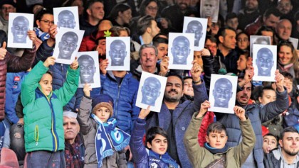 Napoli fans don masks to support racism victim