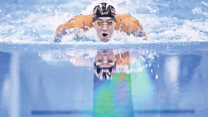 Phelps splashes to 22nd gold