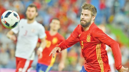 ‘Proud’ Pique to carry on for Spain 