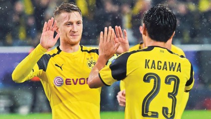 Hattrick delights Reus, Tuchel in record win