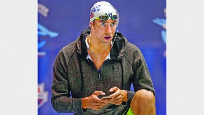 Phelps wins 100 meter butterfly at Swim Nationals 
