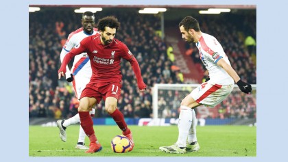 Salah double keeps Reds on top