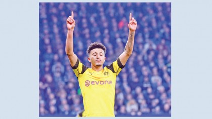 Sancho shoots Dortmund nine points clear
