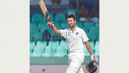 Pujaras comeback century lifts India