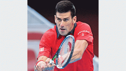 Djokovic reaches quarters in style