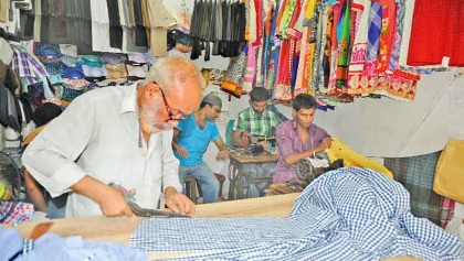 Tailors spend busy nights ahead of Eid